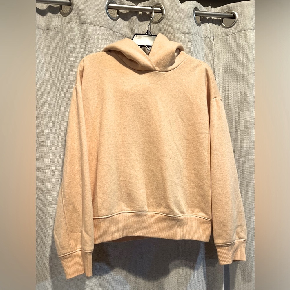 Pale yellow hoodie.